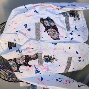 White jacket with black sequins and candy skulls on it